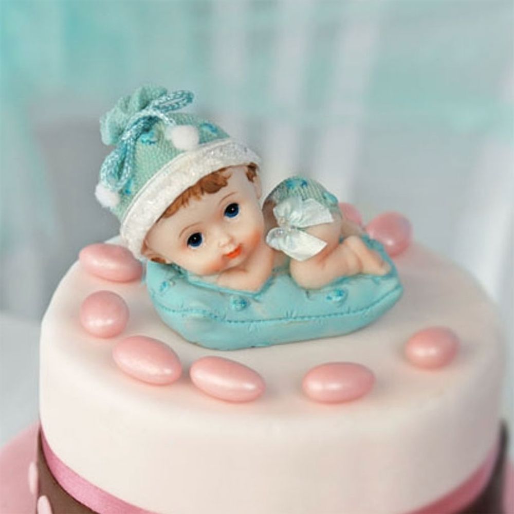 Kakefigur Guttebaby på Pute